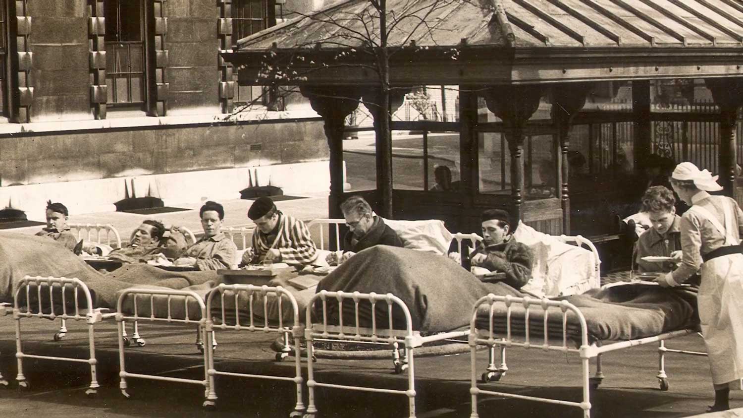 Patients wheeled out into the square in their beds